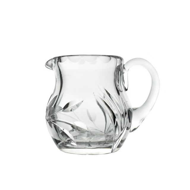 Add a touch of vintage sophistication to your table settings with this elegant mid-20th century cut glass set, comprising...