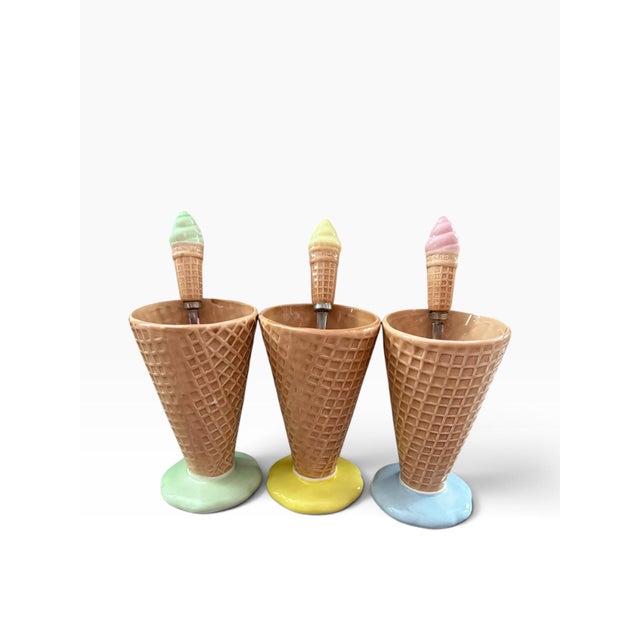 Absolutely adorable vintage ceramic dessert set featuring three whimsical ice cream cone-shaped serving cups, each with a...