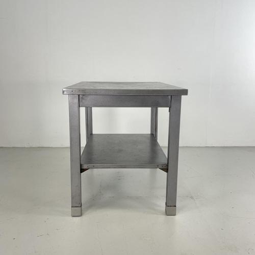 Lovely vintage industrial stripped and polished steel side table / desk with pull our shelf by Remington Rand. In good...
