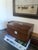 A handsome antique mahogany writing box featuring a rich aged patina, mother-of-pearl inlaid cartouche and escutcheon, and...