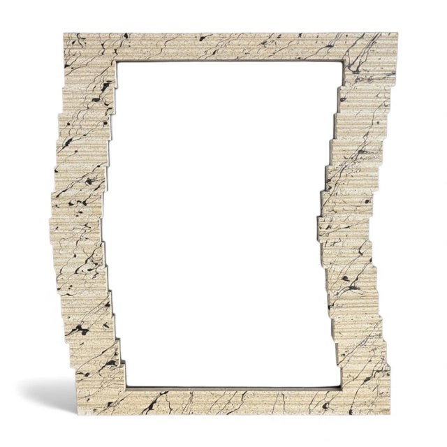 This textured wall mirror combines vintage charm with modernist design to create a sculptural frame mirror that elevates...