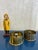 Solid Pair Brass Artillery Casings redesigned as Ashtrays, bearing coins as centerpieces: - 1960 British Five Shilling...