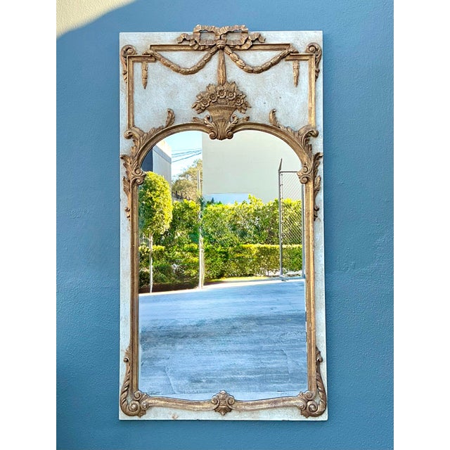 Add a touch of Parisian opulence to your interior with this magnificent vintage trumeau mirror. A masterful study in...
