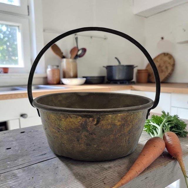 An antique brass hearth bucket or small cauldron, likely of European origin and dating to the late 19th century. The...