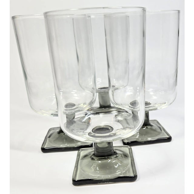 This sweet set of Danish modern goblets have a streamlined design, with square feet in a medium gray and a flat bottomed...