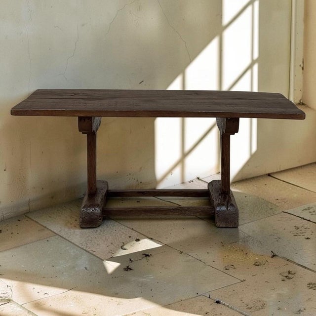 Handcrafted from solid oak, this authentic 19th century rustic coffee table possesses the honest character and enduring...