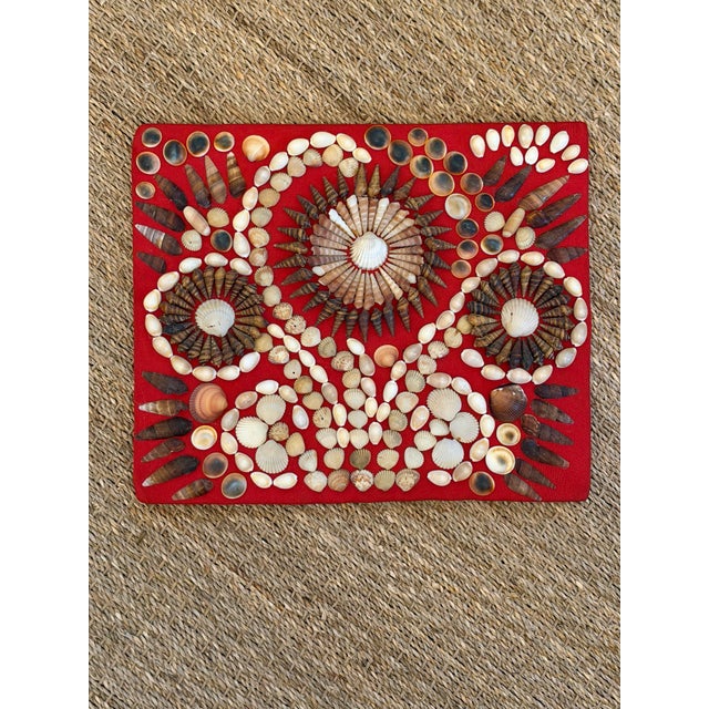 This is a vintage handcrafted seashell folk-art panel, featuring an elaborate symmetrical arrangement of natural shells...