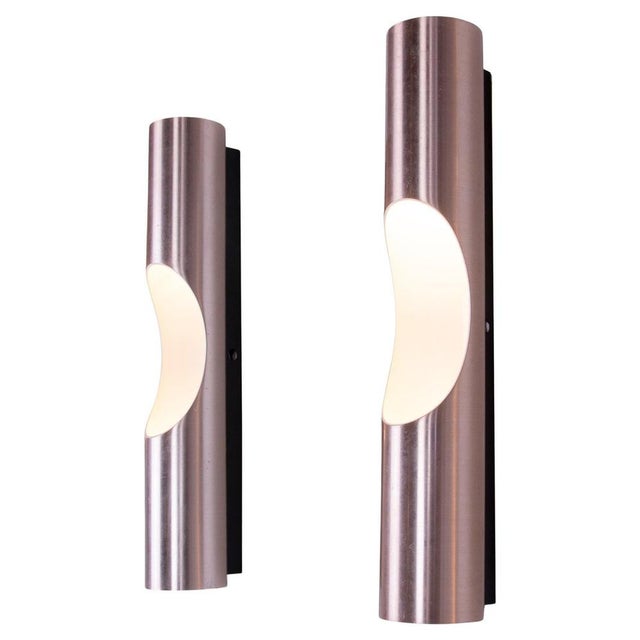 Elegant set of two copper coloured anodised aluminium sconces model "fuga" c-1630.12 by maija liisa komulainen for raak,...
