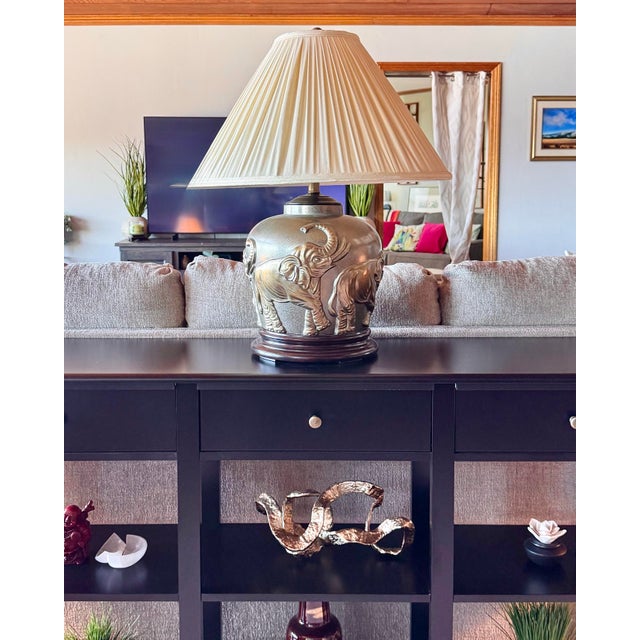 Vintage Large Gold Embossed Elephant Table Lamp with Wood Base Striking vintage oversized table lamp featuring an elegant...