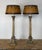 An exceptionally atmospheric and highly collectible pair of vintage Italian Neoclassical column table lamps, rendered as...