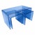 Elevate your living space with this striking set of three transparent blue acrylic nesting tables—where modern minimalism...