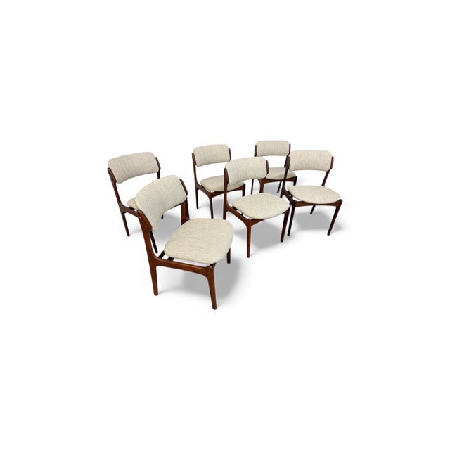 This exceptional set of Mid-Century Danish Modern dining chairs by renowned designer Erik Buch exemplifies timeless...
