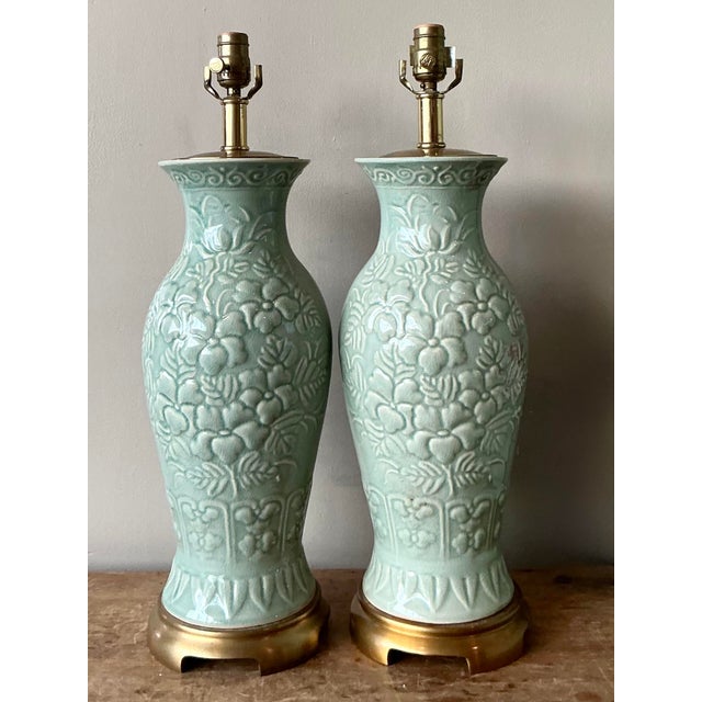 Elevate your interior with this exquisite pair of vintage Maitland Smith table lamps, a testament to timeless...