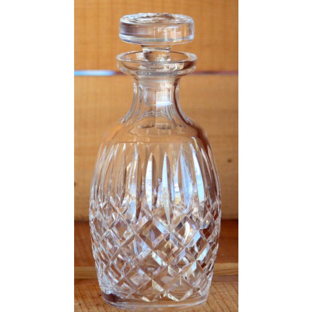This is a vintage cut crystal Waterford Lismore liquor decanter with original stopper. The decanter measures 9.5 inches...