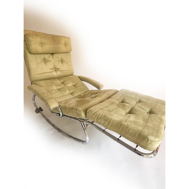 The curved form of the chrome-plated frame gives this piece a light, almost floating appearance, while the softly...