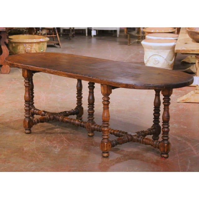 This interesting antique farmhouse table was crafted in southern France circa 1880 and reflects the enduring vernacular...