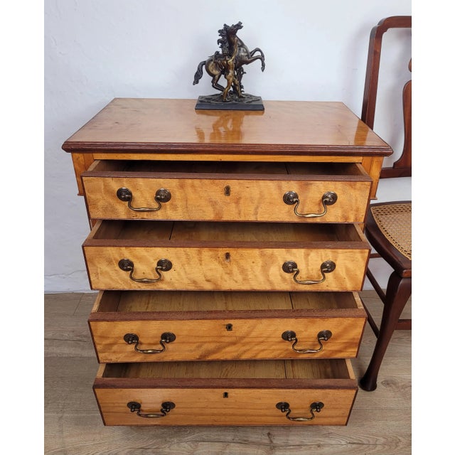 This is a gorgeous antique styled chest of drawers that displays a beautiful patination to the wood, truly adding a warm...