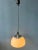 Classic Guzzini 'Faro' acrylic glass pendant lamp. The white shade is made of acrylic glass and produces a magnificent...
