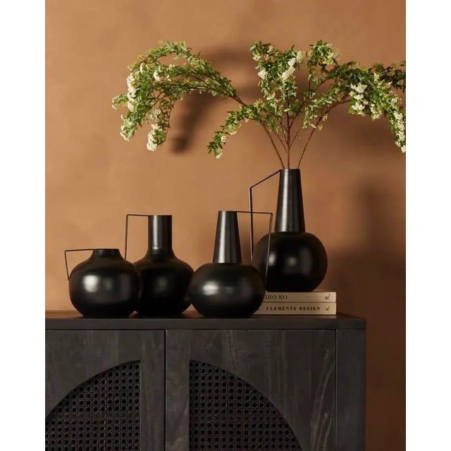 The ideal accents on mantels or tabletops, set of four decorative vases of matte black iron, in varied sizes for endless...