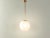 Classic ball ceiling lamp from the Bauhaus era from the 1950s. Lampshade made of opal glass with hanging metal...