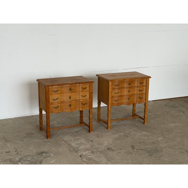 A pair of Danish oak chest of drawers in the Rococo revival manner, 1960s — in the style associated with Henning Kjærnulf...