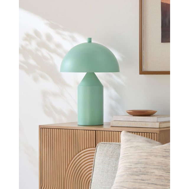 Illuminate your space with the Elder accent table lamp, a striking blend of industrial rustic charm that will captivate...