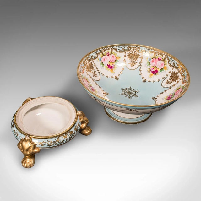 This is an antique decorative footed bowl. A Japanese, ceramic two piece serving dish by Noritake, dating to the early...