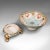 This is an antique decorative footed bowl. A Japanese, ceramic two piece serving dish by Noritake, dating to the early...