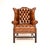 An exceptional antique deep buttoned leather wing back armchair. This was made in England, it dates from around the...