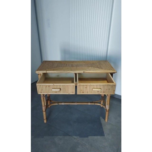 Bamboo console table. vintage. circa 1970s-1980s. in the style of vivai del sud. with two drawers that glide smoothly. the...