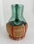 Beautiful vintage green blown glass pitcher featuring a rattan woven base. This could work for a bar cart, open shelves,...