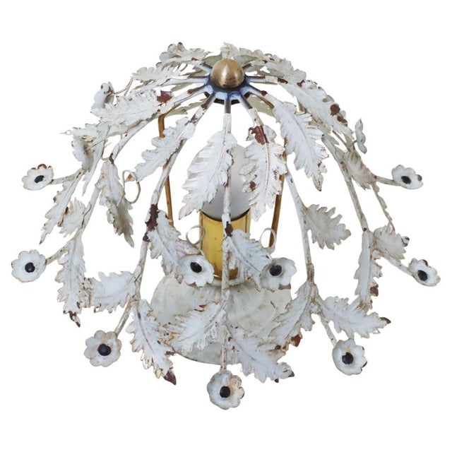 This little ceiling light is a real charmer. Its natural aging gives it a touch of elegance. The tiny blossoms are...