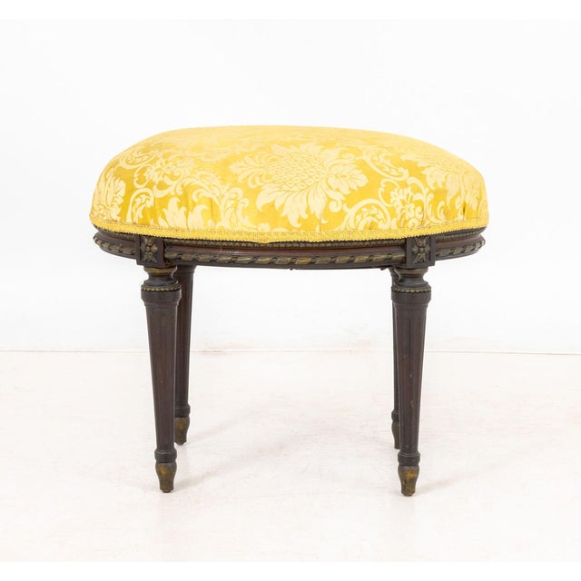 Louis XVI Style Yellow Silk Upholstered Oval Foot Stool, ebonized wood frame, fluted tapering legs. 18.5" H x 21" W x 16"...