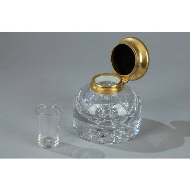 19th century malachite inkwell. The circular plate for resting a fountain pen houses a crystal inkpot in its center. The...