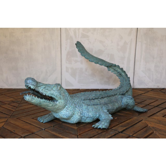 An exceptional and highly decorative 1970s bronze crocodile sculpture, masterfully cast with remarkable realism and...