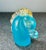 Art glass in the form of a decorative horse head in aqua blue with the ears and mane accented with clear glass and gold...