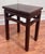 This elegant vintage piece is a traditional Chinese Ming-style side table featuring a clean rectangular top with a...