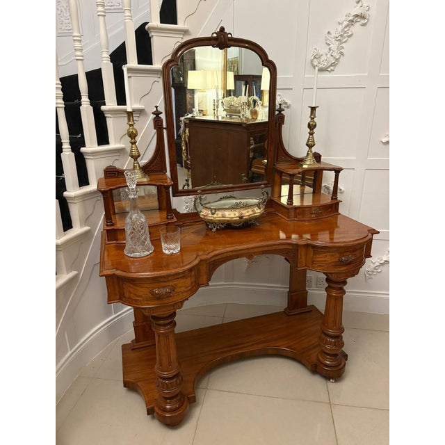 A superb quality antique Victorian carved mahogany dressing table of excellent quality and refined design. The raised...