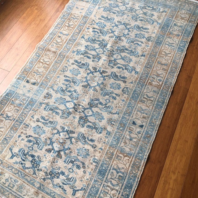 A refined antique Malayer rug, handwoven in early 20th-century, celebrated for its elegant proportions and intricate...