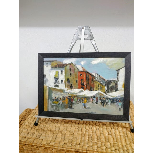 Here's a fine painting of an Old World Outdoor Market created by May Midday Knauf (1927-2025)) of Saratoga Springs New...