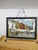 Here's a fine painting of an Old World Outdoor Market created by May Midday Knauf (1927-2025)) of Saratoga Springs New...