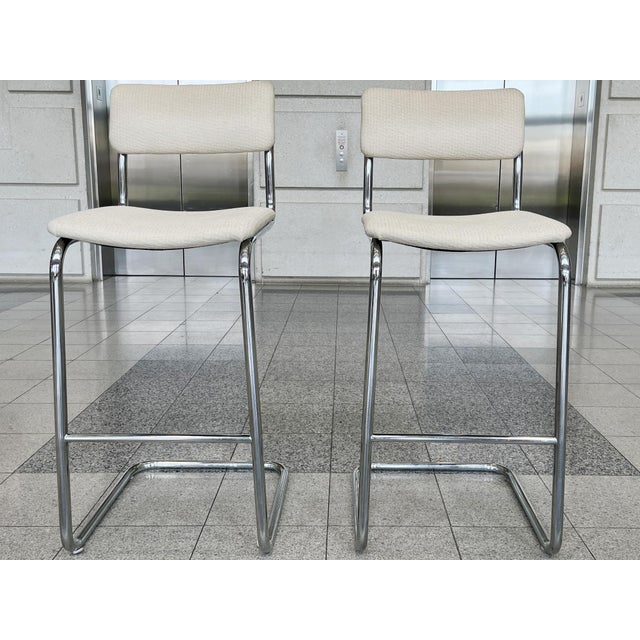 Designed after the iconic cantilevered chairs by Marcel Breuer, these barstools consist of tubular chromed steel frames...