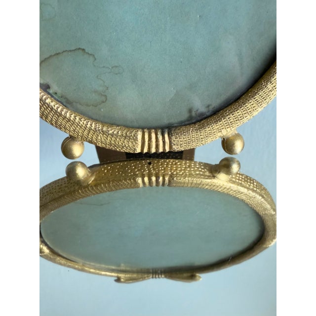 Late 19th Century Antique French Neoclassical Style Gilt Brass Swivel Vanity Frame Ribbon Bow Crest Tabletop Display Frame For Sale - Image 5 of 8
