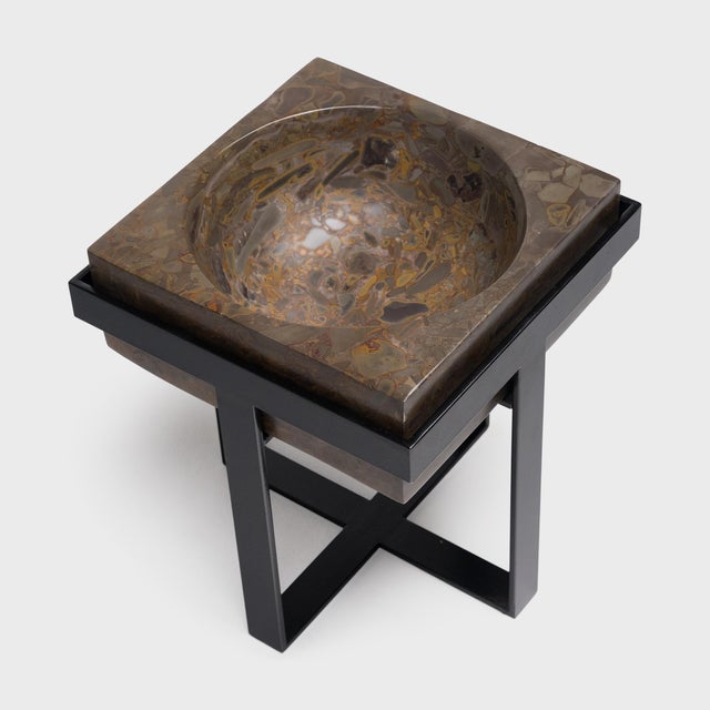 Ideal indoors or out, this clean-lined side table is comprised of a square puddingstone top elevated by a powder-coated...