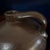 brown salt glaze Crock Jug with some normal imperfections Applied handle. The crock was usually held with one hand slung...