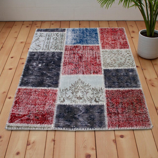 This masterfully composed patchwork rug represents a sophisticated dialogue between Anatolian history and contemporary...