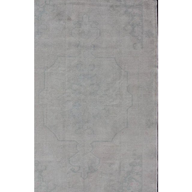 Measures: 4'5 x 7'0. Turkish Oushak Rug in Faded Steel Blue and Soft Gray with Subtle Medallion. Keivan Woven Arts / rug...