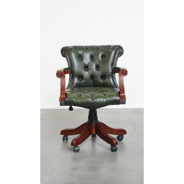 Offered this timeless green cowhide leather chesterfield office chair in English style on casters. This nice green cowhide...