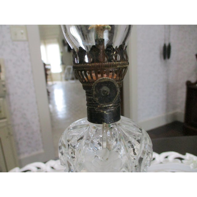 The product is a extremely rare Hawkes miniature oil lamp from the American Brilliant Period, signed and featuring an...