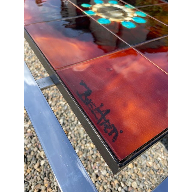 Rectangular tiled coffee table by Juliette Belarti dating back from the late 70’s. The tiles are made of ceramic and are...